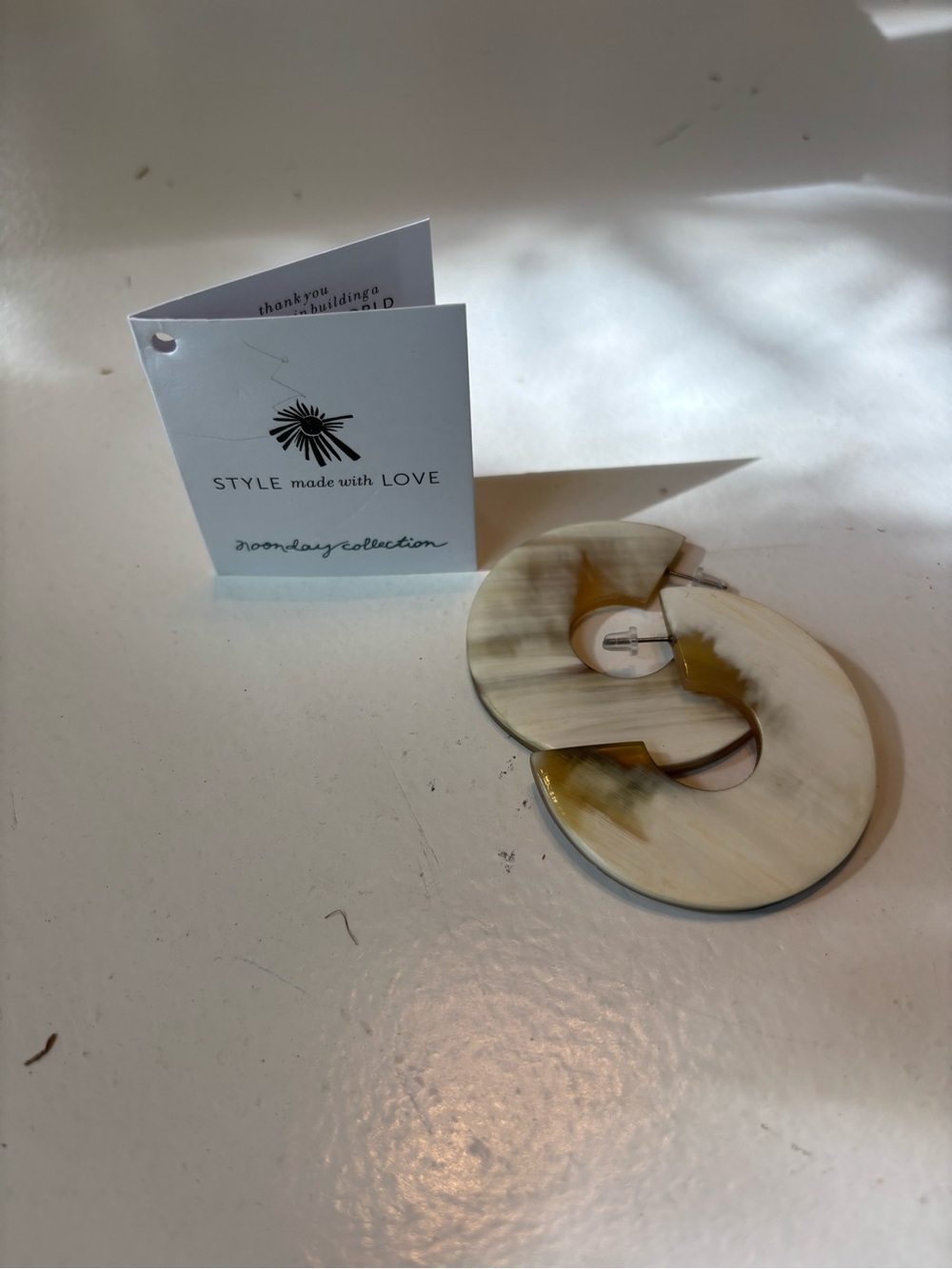 Noonday Collection Cream and Tan Vortex Hoop Earrings